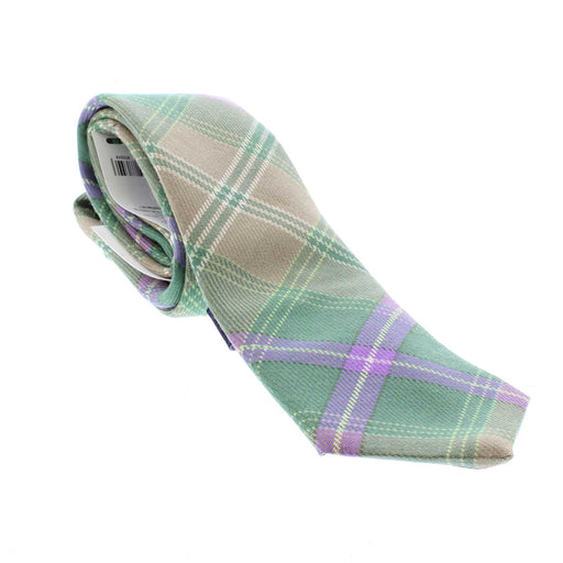 Green and purple tartan woolen tie rolled up. 