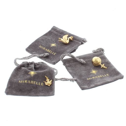A selection of gold plated charms and grey velvet pouches include the gold swan, orb and small thistle 