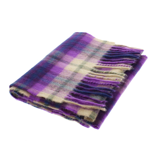 Cashmere Coorie scarf in a purple and cream tartan folded against a white background