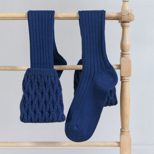 Rannoch Socks Navy shown hanging over clothes horse