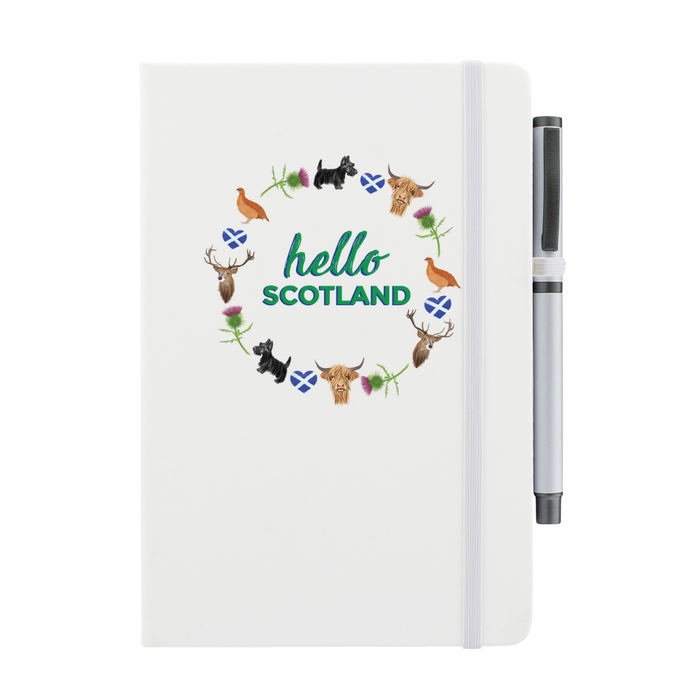 White notebook featuring a circular design of Scottish animals and emblems. 