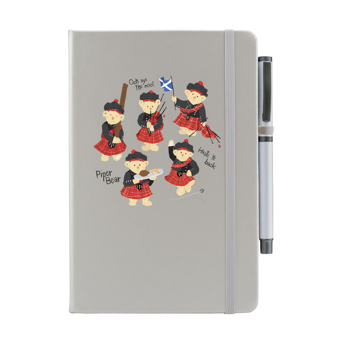 Silver notepad with pen featuring dancing Piper Bear teddy's.