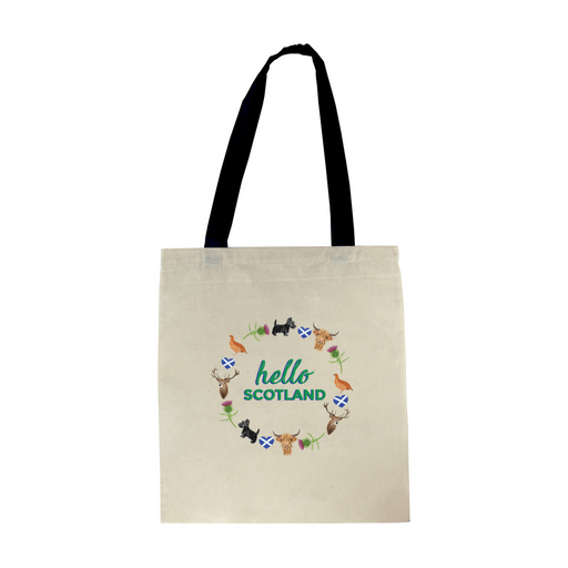 Cotton tote shopper with black straps features a circular design of scottish icons including the St Andrew's flag, a deer, a scottie dog, a thistle flower, a pheasant and a highland cow. Inside the design are the words 'Hello Scotland' in a green font. 