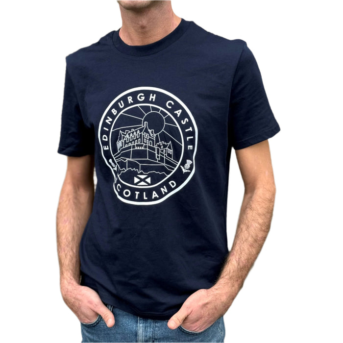 Person wears a Navy T-Shirt with a white circular motif depicting Edinburgh Castle