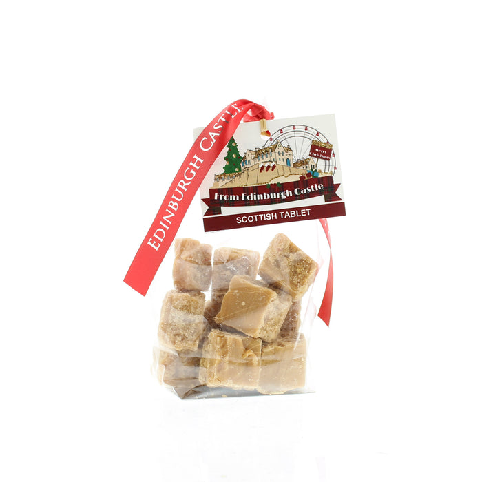 Bag of Edinburgh Castle Scottish Tablet confectionary tied with a red ribbon.