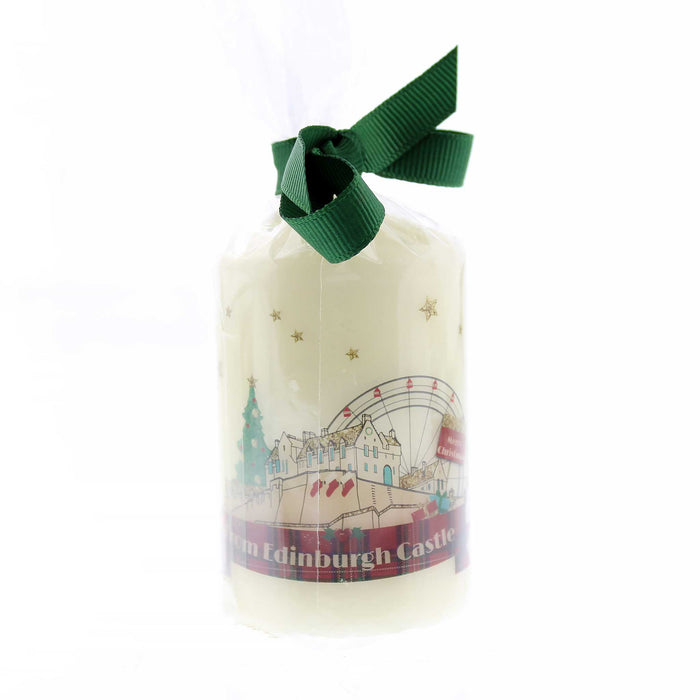 Small candle featuring a Christmas scene of Edinburgh Castle including a Big Wheel and Christmas Tree. The candle is wrapped in cellophane with a green bow.  