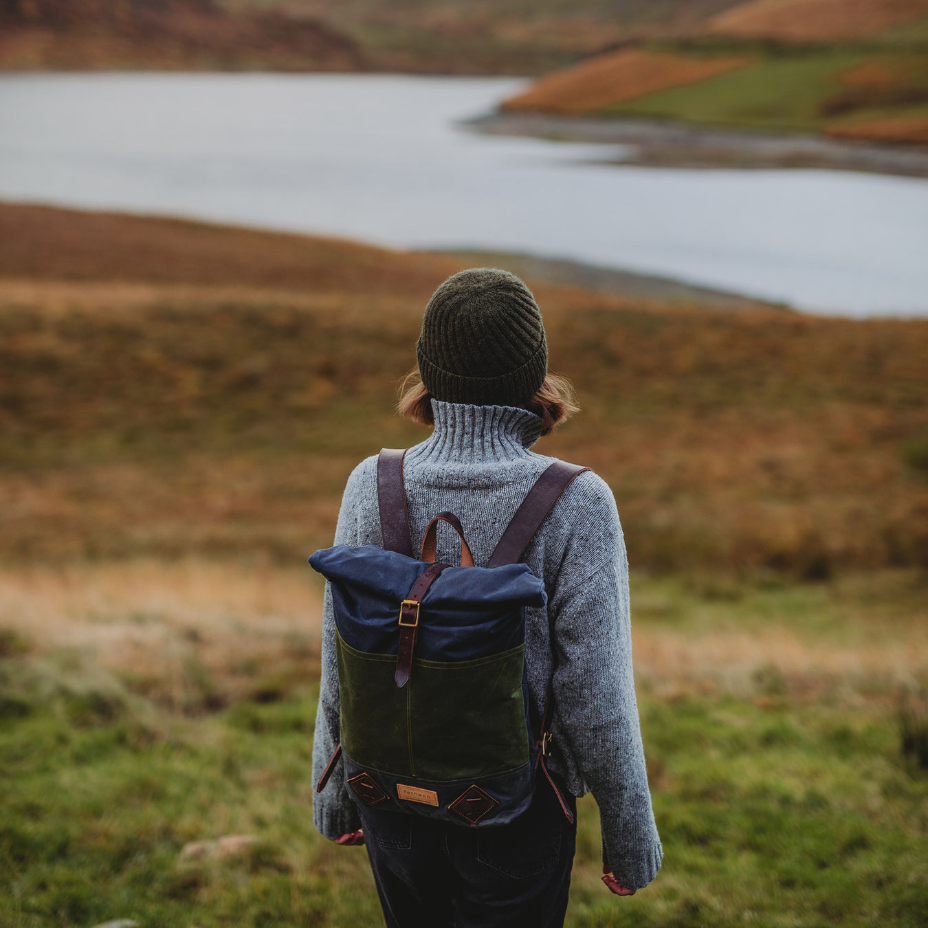 fernweh waxed small backpack shown on women in scottish hills near a loch - Image