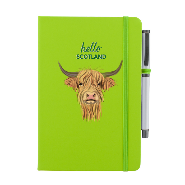 Soft Touch lime green notebook featuring a Highland Cow and the test reads 'hello SCOTLAND'. A lime green strap closes over the right hand side with a matching pen.