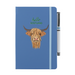 Blue soft feel note pad with a highland cow motif. the text above reads 'hello SCOTLAND' and comes with a silver pen attached.