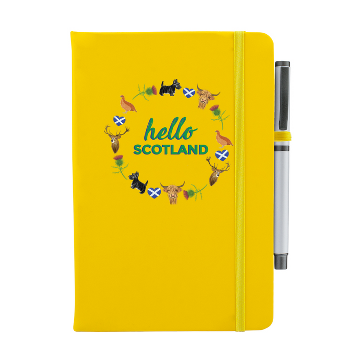 Yellow notebook featuring a circular design of Scottish animals and emblems. 