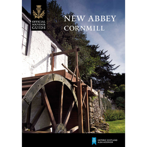 The front cover of the New Abbey Corn mill guidebook features a photographic print of the mill wheel and a white building. 