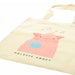 The cotton Melrose Abbey Tote with a bagpiping pig is laid flat against a white background.
