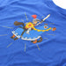 Close up of the knight on a horse design on the back of a blue t-shirt. 