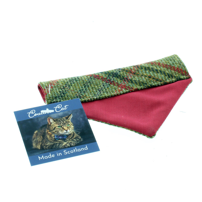 The underneath of Green Tweed Tartan Cat Bandana showing a red lining. 