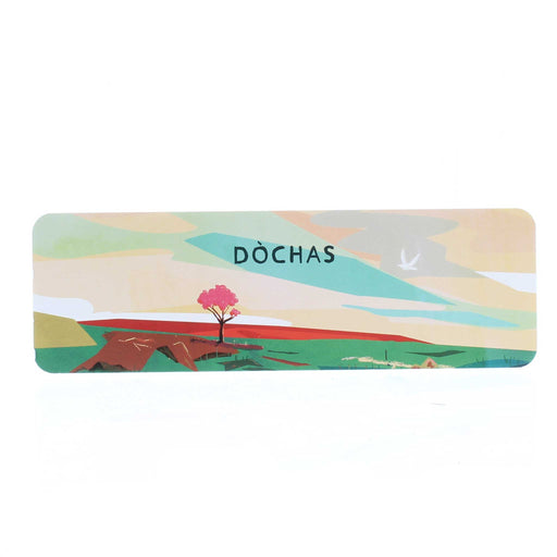 Paper bookmark featuring a Scottish landscape at sunset with a white dove in flight. The word reads Dòchas which is Gaelic for Hope. 