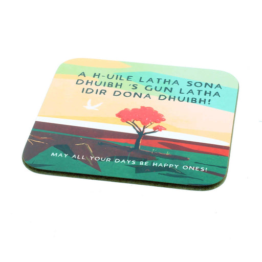 Coaster features a calming sunset image with gaelic writing that translates to 'May all your days be happy ones'
