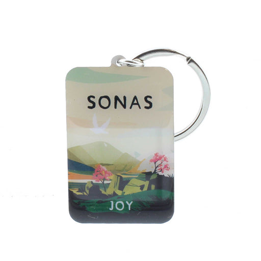 Small enamel keyring with silver hardware. The keyring features a print of a landscape at sunset, the text reads 'sonas' which is Gaelic for joy. 
