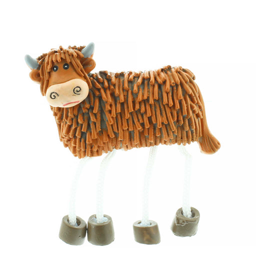 Fridge magnet featuring a textured highland cow with stringy legs. 
