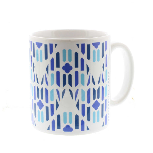 White ceramic mug with a blue all over print inspired by Dunfermline Abbey Windows. 