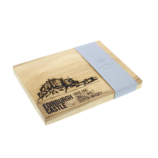 An elegant chopping board made of oak featuring the iconic Edinburgh Castle, engraved with 'Highland And Single Malt Scotch Whisky' text. 