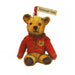 Small wooden tree decoration in the shape of an old fashioned Teddy Bear. The teddy is wearing a red night coat and has a red ribbon for hanging. A small tag on the ribbon reads 'Edinburgh Castle'. 