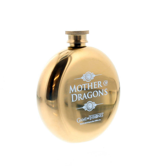 Side view of the circular gold metal flask with 'Mother of Dragons' printed in white. 
