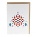 A white greeting card features a simple arched design compiled of red, orange and blue circular prints. 