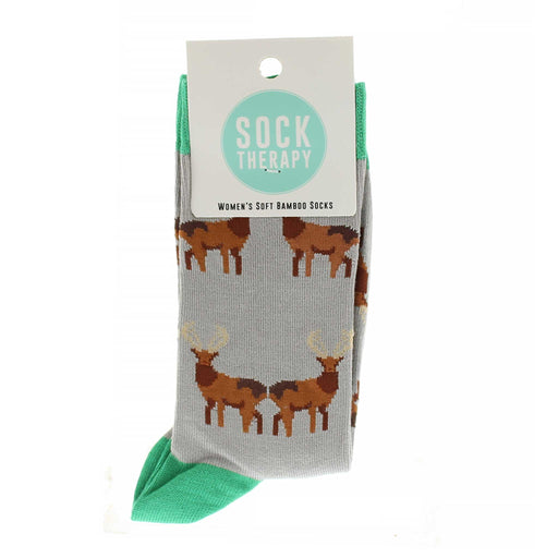 Beige/Grey ankle socks with green trims feature an all over print of a red stag. 