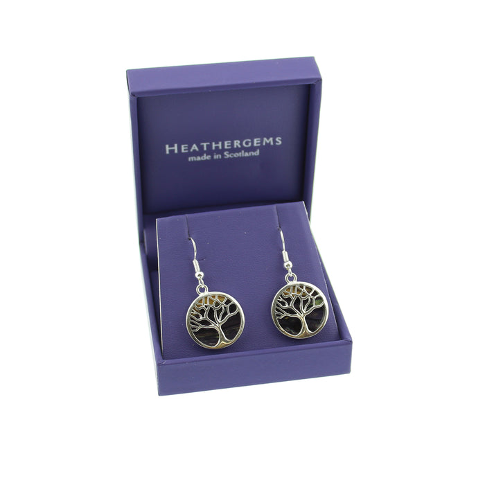 Purple box with sterling silver drop earrings containing a brown and yellow stone made from Scottish heather