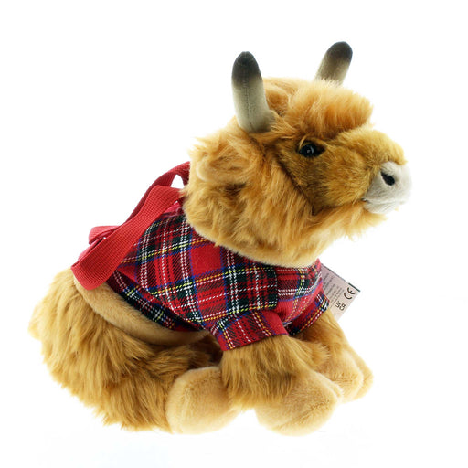 Side view of a fluffy Highland Cow Carry bag wearing a red tartan coat. 