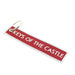 Red fabric keyring reads 'Keys of the Castle' in white embroidery. 