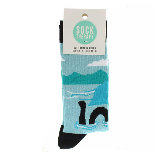 Aqua blue ankle socks with Black trims featuring a print of Nessie and Loch Ness.