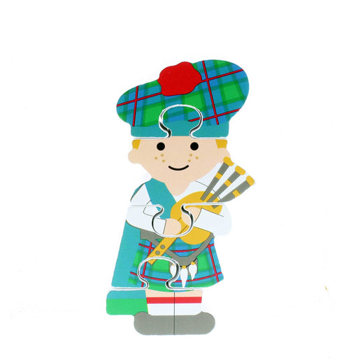 Wooden Piper Puzzle toy. The piper is wearing traditional Highland dress and is holding a set of pipes. 