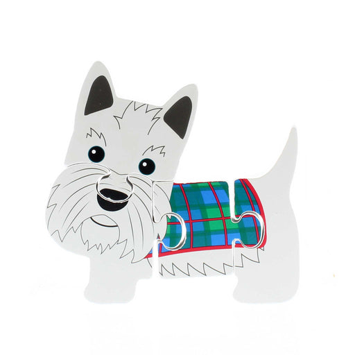 White Wooden toy puzzle in the shape of a Scottie Dog with a tartan coat. 
