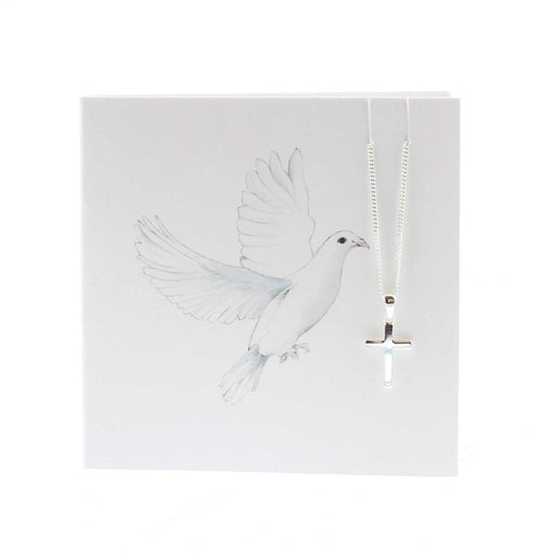 White card with a print of a white dove in flight. The card has a silver cross chain hanging from the  in the top right hand corner. 
