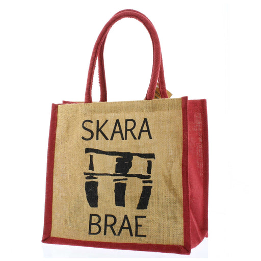 Hessian Jute Tote with a print of some of the stones left at Skara Brae. The words 'Skara Brae' are also printed on the shopper which has a natural colour with red sides, handles and trims.