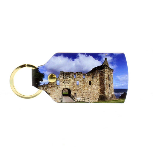 Rectangle shaped leather keyring with gold ring hardware features a printed photograph of the St Andrews Castle against a blue sky. 