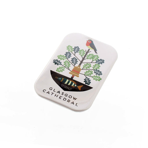 White rectangular magnet featuring a print inspired by the patron St Mungo which includes a fish, tree and bird. 