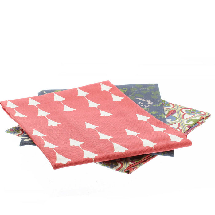 Trio of Stirling Castle Tea Towels folded, the red tulip print option at the top. 