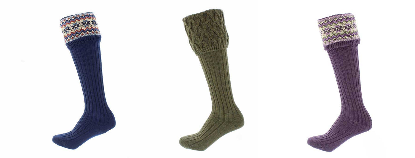 3 knee high woolen socks with fair isle designs at the top. Tap to shop 