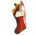 Small wooden tree decoration in the shape of an old fashioned Teddy Bear. The teddy is popping out of the top of a Red Stocking and has a red ribbon for hanging. A small tag on the ribbon reads 'Urquhart Castle'. 