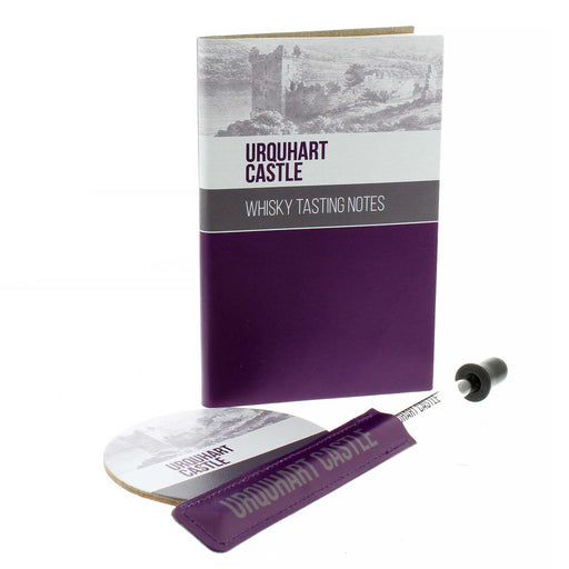 The full Urquhart Castle Whisky Accessory range featuring a notebook, pipette and coaster.