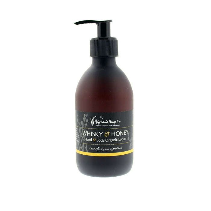 Dark pump action bottle containing Hand & Body lotion with a Whisky and Honey scent. 