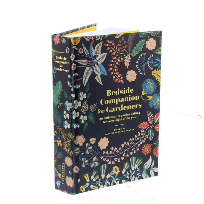Front cover of the book 'Bedside Companion for Gardeners' has a black background with drawings of brightly coloured flowers around the edges with the books name in the middle. 