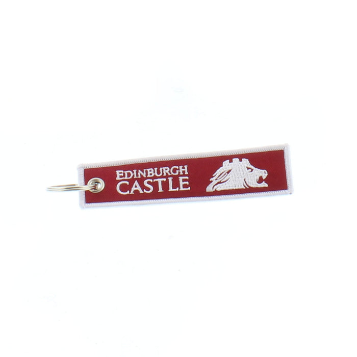 Red fabric keyring with the words 'Keys to the Castle' embossed on the back with Edinburgh Castle official Logo