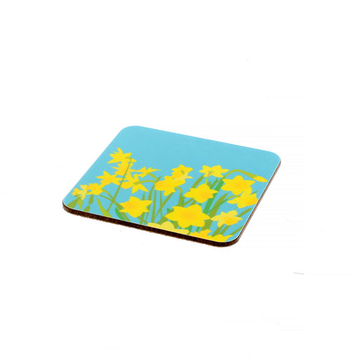 Bright blue coaster with yellow daffodil print.
