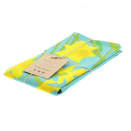 Bright blue tea towel with a bold yellow daffodil print. 