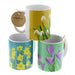 Trio of ceramic mugs with a daffodil print, snowdrop print and crocus print. 