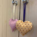 Tulip Lace Print and Thistle Print Lavender Heart Bag hanging on a wardrobe handle 