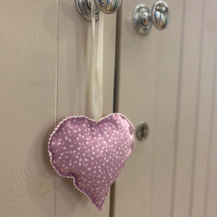 Tulip Lace Print Lavender Heart Bag hanging on a wardrobe handle 